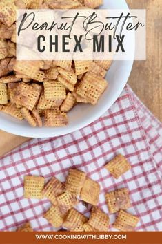 a bowl full of peanut butter chex mix on top of a checkered table cloth