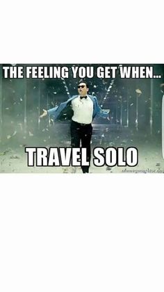 a man standing in front of a sign that says, the feeling you get when travel solo