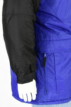 "Royal blue with contrasting black on the shoulders, sleeves, & zipper pulls. Polyfill. Elasticized cuffs. 6 outside front zip pockets. Inside waist adjuster . Great pre-owned vintage, however, the coat is missing its zip-off hood. Estimated Modern Size: XL *Vintage clothing runs significantly smaller than modern clothing. We offer a comprehensive size estimation in accordance with modern-day size charts. Vintage Tag Size: XL Material: nylon Lining: synthetic Closure: zip, velcro, & snap Blue Long Sleeve Weatherproof Windbreaker, Blue Nylon Outerwear For Winter Sports, Blue Functional Track Jacket For Winter, Winter Blue Windbreaker With Zipper Closure, Blue Functional Winter Track Jacket, Blue Windbreaker With Zipper Closure For Outdoor, Blue Windbreaker With Pockets For Cold Weather, Blue Windbreaker With Zipper For Outdoor, Blue Long Sleeve Windbreaker For Winter Sports