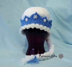 a crocheted hat with white and blue trim