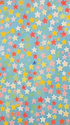 an image of colorful stars on a blue background with red, yellow and green colors