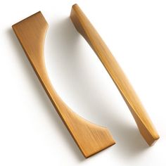 a pair of wooden handles on a white background with clippings to the side