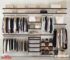 an organized closet with clothes, shoes and handbags on shelving units for storage