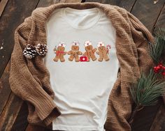 Celebrate the festive spirit with our Gingerbread Nurse Christmas Shirt, the perfect blend of holiday cheer and nursing pride! This adorable Nurse Holiday Shirt makes a fantastic Cute Nurse Gift for nursing students and professionals alike, adding a touch of fun to their wardrobe. Ideal for class or holiday gatherings, it's a must-have Nursing School Tee that spreads joy and warmth all season long! 🎄 Unleash the holiday spirit with our Gingerbread Nurse Christmas Shirt! This delightful piece seamlessly weaves together festive cheer and nursing pride, making it a standout addition to any healthcare hero's wardrobe. Imagine strolling through the winter wonderland, turning heads and sparking smiles wherever you go.  🎅 Infuse your holiday gatherings with flair! Our Nurse Holiday Shirt isn't Nursing Profession, Nursing Student Gifts, Cute Nurse, Nurse Christmas, School Tees, Holiday Shirt, Holiday Looks, Professional Look, Holiday Gathering