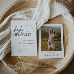 an image of a baby shower and wedding card on a wooden bowl with a white blanket