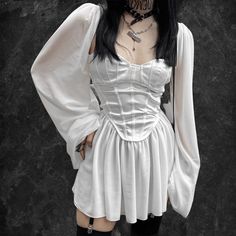 𝔇𝔢𝔱𝔞𝔦𝔩𝔰: Style: Goth, Fairy Grunge, Streetwear Materials: Chiffon & Polyester Soft & light Quantity: 1 pc You look heavenly in this white goth dress with its bell sleeves & beautiful corset Solid durable material, perfect for spring & summer Enjoy free shipping with a purchase of over 80$ SIZE WAIST LENGTH HIP BUSTS 25-28 in 28 in 33-36 in 33-35 inM 27-29 in 29 in 34-38 in 35-37 inL 28-31 in 29 in 36-39 in 37-39 inItem measured by hands may have 1-2in differences.SIZE WAIST LENGTH HIP BUSTS 6... Fairycore Mini Dress For Costume Party, White Fairycore Corset Dress For Party, Spring Fairycore Cosplay Dress, Fairycore Long Sleeve Fairy Dress For Party, Fairy Grunge Long Sleeve Dresses For Spring, Spring Fairy Grunge Long Sleeve Dresses, Long Sleeve Fairycore Dress For Party, Fitted Fairy Dress For Costume Party, Fairycore Corset Dress For Cosplay