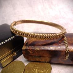 An beautifully decorated Victorian 15ct rose gold hinged bangle.  I love the way that antique and vintage jewellery has a story to tell. This stunning bangle is around 140 years old and I find myself wondering what the history of this piece is. This bangle was made around 1860-80s when the Victorians were facinated with what was being learnt of the past from archiological digs of ancient Roman sites. The style of this bangle is very influenced by the Etruscan Revial of this period. The clever  f Gold Gate, Vintage Jewlery, Ancient Designs, Bead Bangles, Diamond Star, Antique Roses, Antique Diamond, Optical Illusion, Hinged Bangle