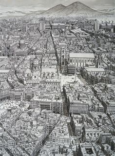 an aerial view of a city with tall buildings and mountains in the backgroud