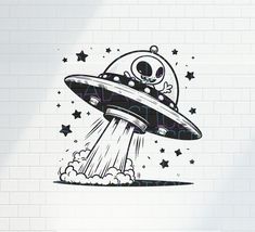 an alien ship flying through the air with stars around it and a skull on top