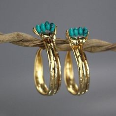 This unique and powerful design of golden crown hoop earrings came out of a session in my studio when the flattened gold filled material had been accidentally folded on both sides. The gold filled was flattened and created a rustic, ancient look that would've blended beautifully when the Aztecs were once in power. Turquoise howlite golden crown hoop earrings would be a perfect compliment for a wedding party or as a wedding gift. The earring's backs are handmade and have a very useful and comfort Howlite Jewelry, The Aztecs, Opal Birthstone, Gemstone Hoop Earrings, Boho Life, Golden Crown, Turquoise Boho, Coral Earrings, Home Decor Boho