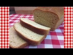 a loaf of bread sitting on top of a red and white checkered table cloth