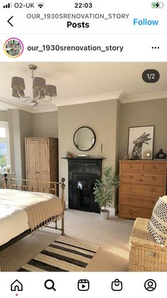 a bedroom with a bed, dressers and a mirror on the wall above it