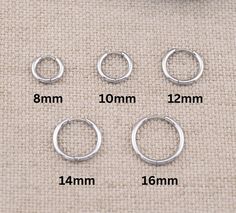 Our small huggie hoop earrings set of 3 pairs in variety of sizes is here! They are dainty but durable, perfect for layering in stacks, and their chucky thick shape make them stand out. Their small or medium size makes them easy to style. Also their comfortable fit makes them a great choice for all-day wear and even sleep in them. These small hoops / huggies are sterling silver finish, hypoallergenic, tarnish free and waterproof !   - Inner diameter : 8mm, 10mm, 12mm, 14mm, 16mm - Thickness of hoop: 2mm - Sterling Silver finish. Core material is surgical grade non-tarnish stainless steel  - Turnaround time: Same day or Next day delivery guaranteed  - Qty: 3 pairs - Carefully inspected and individually packed in a gift jewelry box - Please ask me any questions ! I am quick to reply :) Thank Multiple Piercings, Tarnished Silver, Hoop Earring Sets, Huggie Hoop Earrings, Jewelry Earrings Hoops, Silver Hoops, Jewelry Gift Box, Silver Hoop Earrings, Earrings Set