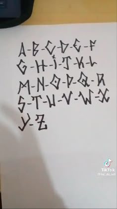 the letters are written in cursive writing on a piece of paper with a pen