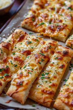 several slices of pizza with cheese and herbs