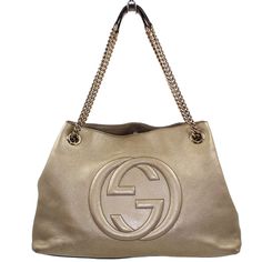 Expertly crafted from luxurious gold metallic pebbled leather, the Gucci Soho Chain Shoulder Bag combines elegance and functionality. Featuring gold hardware and an interlocking GG quilted logo on the front, this bag has a clasp closure and a spacious interior with a zipper pocket. Perfect for adding a touch of glamour to any outfit. *All designer bags to come with a certificate of ity*  Condition: This item is in very good used condition. Exterior: Signs of wear can be seen throughout the bottom of the bag and the corners. Interior: Minimal signs of wear throughout the interior. Measurements: Length: 15' Width: 4.5' Height: 11' Strap Drop - Shoulder Strap: 9'  * sells ,   luxury items and is in no way affiliated  with the designer brands we sell. Please be sure to review all photos and co Interior Measurements, Interior Minimal, Gucci Soho, Bag Names, Bottega Veneta Shoulder Bag, Vuitton Bag, Chain Shoulder Bag, Exclusive Bag, Casual Backpack