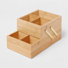 two wooden boxes with handles are stacked on top of each other and one is empty