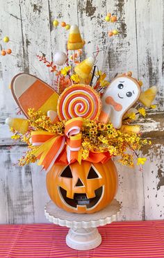 a pumpkin decorated with candy and candies