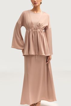 Our Samia Satin Tie Front Top in Cafe au Lait is the epitome of elegance and sophistication. With its flare sleeves and loose, modest silhouette, this top exudes a sense of refined luxury. The tie front detailing adds a touch of effortless charm, making it the perfect addition to any wardrobe. Elevate your style with this premium piece. Model is 5'7" and is wearing size XS. Elegant Flowy Solid Color Blouse, Elegant Flowy Blouse, Elegant Peplum Tops For Brunch, Elegant Blouse With Tie Sleeves For Brunch, Elegant Solid Color Bell Sleeve Tops, Elegant Bell Sleeve Blouse, Elegant Spring Blouse With Tie Waist, Elegant Blouse With Tie Waist For Brunch, Elegant Flowy Blouse With Bell Sleeves