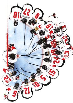 an overhead view of a group of hockey players in the middle of a huddle