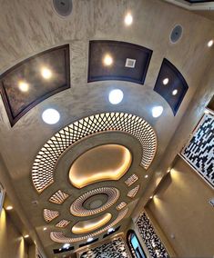 an overhead view of the inside of a building with circular lights and decorative decorations on the ceiling