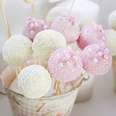 some cake pops are sitting in a bucket