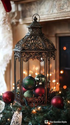 a christmas tree with ornaments in a cage