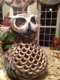 an owl figurine sitting on top of a counter