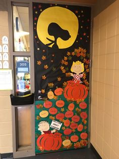 a door decorated with an image of a woman and pumpkins