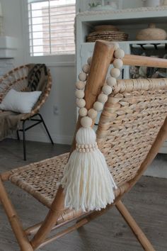 a wicker rocking chair with tassels and beads