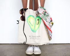 a woman's legs are shown holding a bag with the words nutrition stripped on it