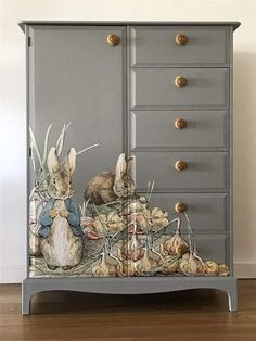 an image of a cabinet with rabbits painted on it