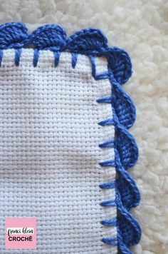 a close up of a piece of cloth with crochet stitching on it