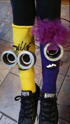 the legs and feet of a person wearing socks with googly eyes