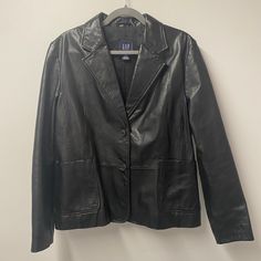 Beautiful Black Genuine Leather Jacket From The Gap From 2002. Immaculate Condition, Nwot. Cross Stitch On The Back Of Jacket Still In Tact. Black Gap Outerwear For Work, Gap Black Spring Outerwear, Black Gap Outerwear For Spring, Spring Black Outerwear By Gap, Coats Y2k, Gap Jacket, Gap Jackets, Genuine Leather Jackets, The Gap