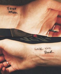 two people holding hands with tattoos on their arms and the words love you dad written on them