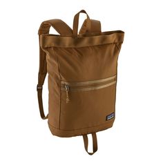 a brown back pack with zippers on the front and side pockets, attached to a shoulder strap