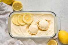 an ice cream dish with lemons on the side