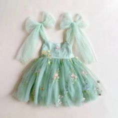 Make your little one feel like a princess with our enchanting tulle dress featuring delicate floral embroidery. This dress is adorned with large bows on the shoulder and around the waist, adding a touch of style and allowing for easy customization. It's the perfect attire for any special occasion, a thoughtful gift, or simply for playing dress-up! To ensure the best fit, we've sized this dress based on average toddler height within the following age groups: 1 Y - 80cm / 31.5-inch toddler 2 Y - 9 Green Tulle Dress, Fairy Princess Dress, Tinkerbell Birthday, Floral Tulle Dress, First Birthday Outfit Girl, Green Tutu, Fairy Butterfly, Floral Embroidery Dress, Girls Tutu Dresses