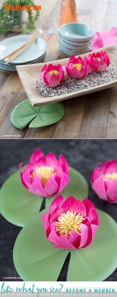 pink water lilies are sitting on green leaves in the center of a table setting