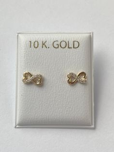 Solid yellow gold stud earrings, a gorgeous infinity design with cubic zirconia , perfectly designed for all ages but crafted with safety screw backs to protect the ears of children young girls and toddlers.  The 10K solid gold earring is perfect for babies, young girls and teenagers and beautiful enough for adults as well. Details: Metal: 10K Solid Gold Color: Yellow Gold  Size: 4x7mm Back: screw back Condition: New Note: All parts are inspected before shipping, we are not responsible if you/or Newborn Earrings, Earrings For Baby Girl, Toddler Presents, Gold Earrings For Kids, Ear Pin, Infinity Earrings, Infinity Design, Baby Earrings