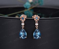 Custom handmade jewelry. The main stone is a 6x8mm pear London blue topaz. The accent stones are London blue topaz and Diamonds or moissanites. The material is solid 14k or 18k gold(white,yellow,rose gold available). This jewelry can also be made in solid 10k,14k,18k gold,with real diamonds.Contact me! Need rush order? contact me! Need custom making order? Contact me! I have confidence on my jewelry.30 days money back guarantee!(For returned item,as this is handmade jewelry.Handcrafted fee and s London Blue Topaz Earrings, Blue Topaz Engagement Ring, Flower Drop Earrings, Earrings Rose Gold, Topaz Engagement Ring, Blue Topaz Earrings, Topaz Earrings, Wedding Rings Vintage, Earrings Women