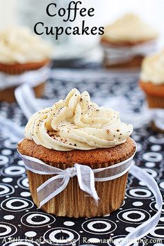 cupcakes with white frosting on a black and white tablecloth, with the words coffee cupcakes in the background