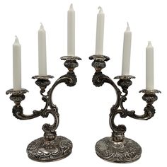 an ornate candelabra with five lit candles