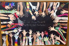 a blackboard with lots of hands painted on it and the words i can change the world within my out there hands