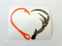 a heart shaped sticker with scissors in the shape of a horse's head