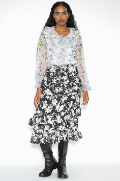 Step into sophistication with our Silk Print Black White Ruffle Layer Skirt. The exquisite painting floral pattern adds an artistic touch, while the lined interior ensures comfort and coverage. This skirt effortlessly combines style and grace, making every step an elegant statement. Embrace the allure of silk, the timeless appeal of black and white, and the charm of ruffle layers—all in one stunning piece. Elevate your wardrobe with this versatile and enchanting skirt that seamlessly transitions Floral Print Flared Evening Skirt, Silk Floral Print Midi Skirt, Evening Flared Skirt With Floral Print, Evening Floral Print Flared Skirt, Summer Evening Skirt With Floral Print, Elegant Floral Print Voluminous Skirt, Summer Evening Floral Print Skirt, Elegant Floral Print Evening Skirt, Elegant Voluminous Floral Print Skirt