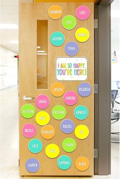 the door to an office is decorated with colorful stickers and words that say i am so happy you're here