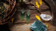 These late summer-inspired ethnic earrings are made entirely by hand. I wove them with high-quality Japanese beads (they are not plastic, but glass). The pattern consists of blueish-green rhombs with a yellow pattern, and down from the rhombs descend strands of beads where the color smoothly shifts from dark green through turquoise to olive and yellow. The bead part is securely attached to a silver base, made by me also by hand, using traditional silversmithing techniques. DIMENSIONS: Entire len Green Bohemian Beaded Earrings With Tiny Beads, Handwoven Green Jewelry For Festival, Green Handwoven Jewelry For Festival, Bohemian Silver Beaded Earrings With Tiny Beads, Bohemian Silver Beaded Earrings, Unique Handwoven Green Earrings, Green Bohemian Handwoven Jewelry, Bohemian Green Handwoven Jewelry, Handmade Green Beaded Earrings For Festivals