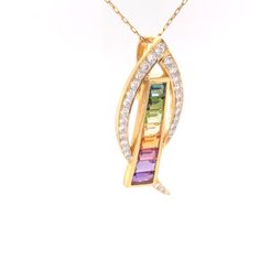 Be enchanted by the mesmerizing allure of this contemporary rainbow pendant, a true masterpiece meticulously fashioned in 18 karat yellow gold. This exquisite creation exemplifies the epitome of international craftsmanship, boasting a breathtaking selection of hand-picked natural gemstones. Unique Rainbow Multi-stone Jewelry, Elegant Rainbow Pendant Necklaces, Unique Multi-stone Rainbow Jewelry, Luxury Multicolor Gemstone Pendant, Rainbow Multi-stone 14k Gold Jewelry, Rainbow Multi-stone Pendant Jewelry, Channel Set, Gemstone Pendant, Natural Gemstones